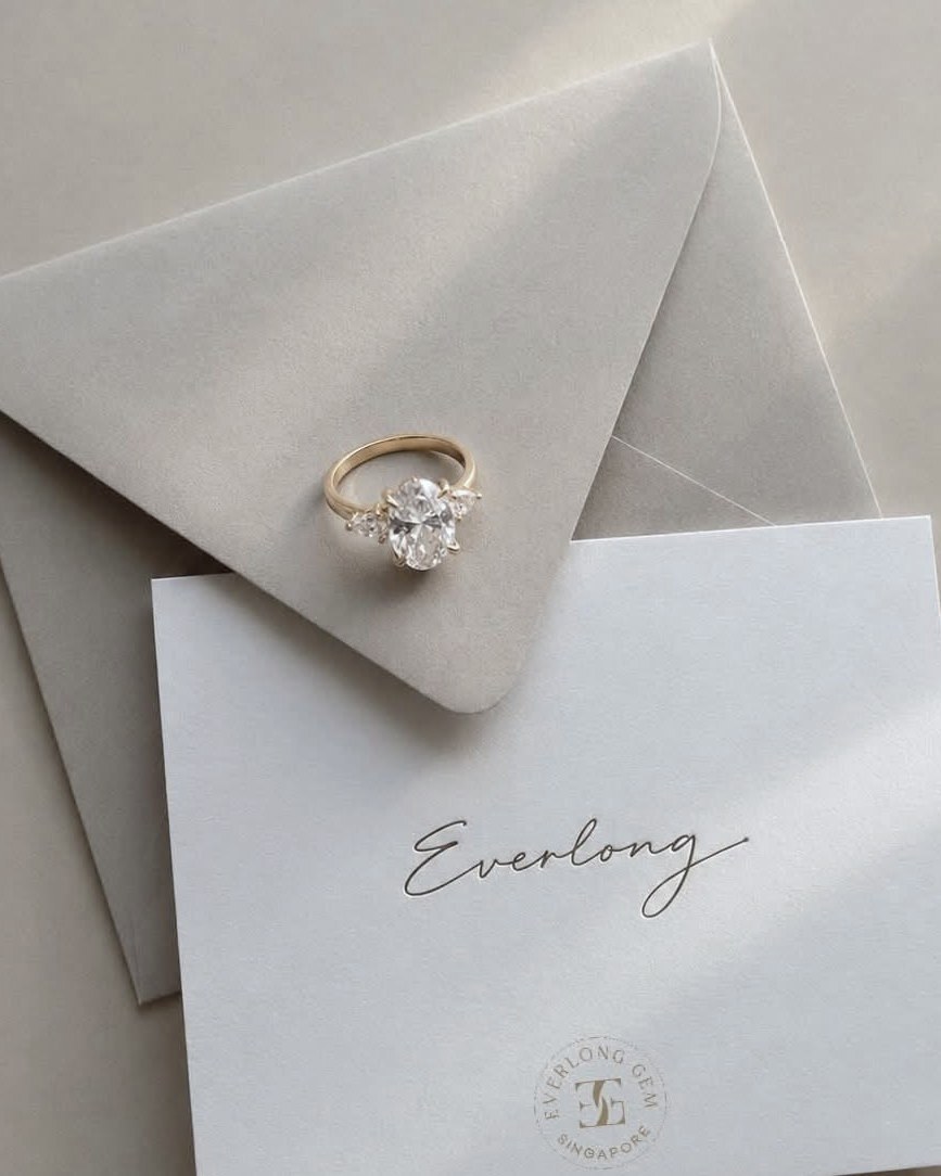A gold ring resting on an envelope and a handwritten card