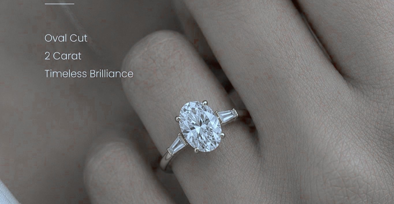 An oval-cut diamond ring worn on the hand