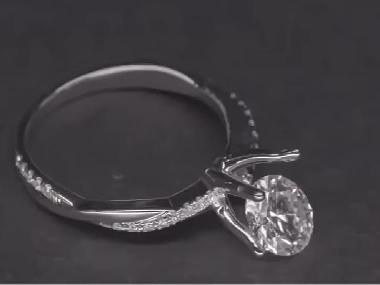 A finished solitaire ring with its grown diamond, on black